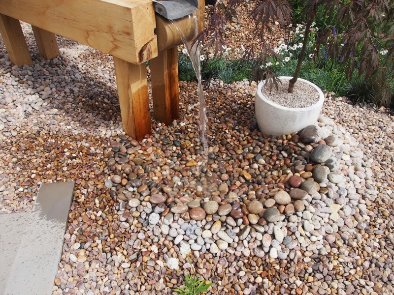 pebbles laid underneath water features